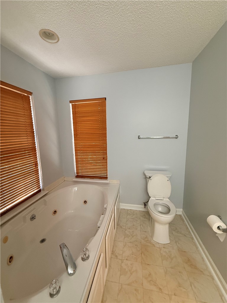 613 Brock Street Central, SC 29630 - Photo 16 of 28 Relax in this inviting bathroom featuring a spacious soaking tub.