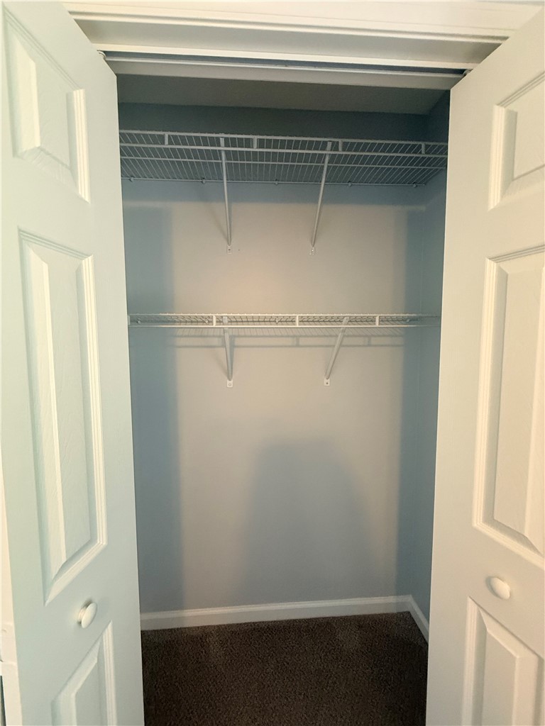 613 Brock Street Central, SC 29630 - Photo 19 of 28 This organized closet offers ample storage with convenient shelving and a neutral color palette.