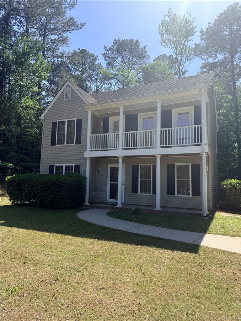 613 Brock Street Central, SC 29630 - Photo 2 of 28 This charming home offers a welcoming facade with a dual-level porch and lush surroundings.