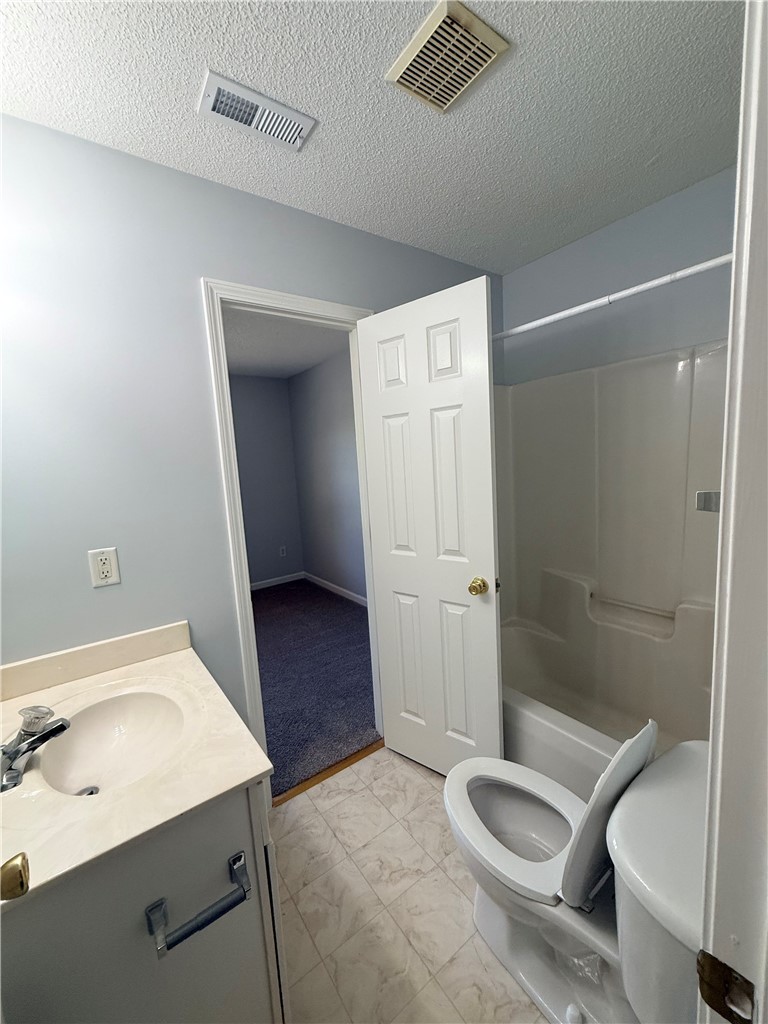 613 Brock Street Central, SC 29630 - Photo 21 of 28 This functional bathroom features a shower-tub combo and a practical vanity.