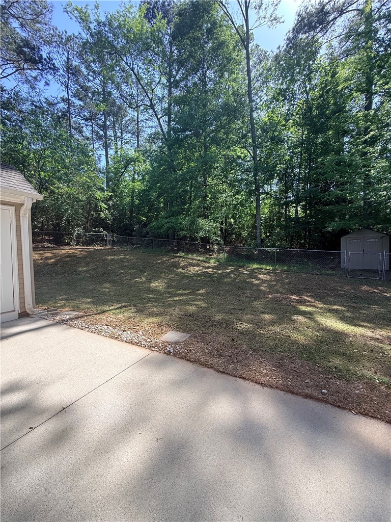 613 Brock Street Central, SC 29630 - Photo 25 of 28 This verdant backyard offers ample space for outdoor enjoyment and relaxation.