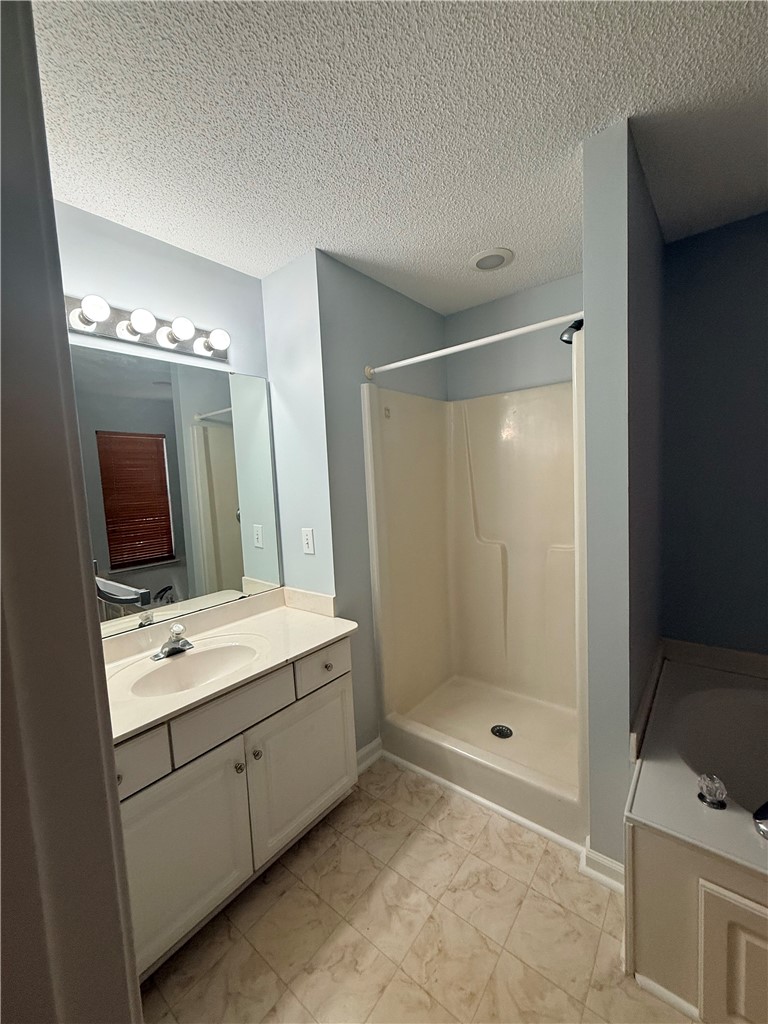 613 Brock Street Central, SC 29630 - Photo 28 of 28 This bathroom features a functional vanity and a clean shower area.