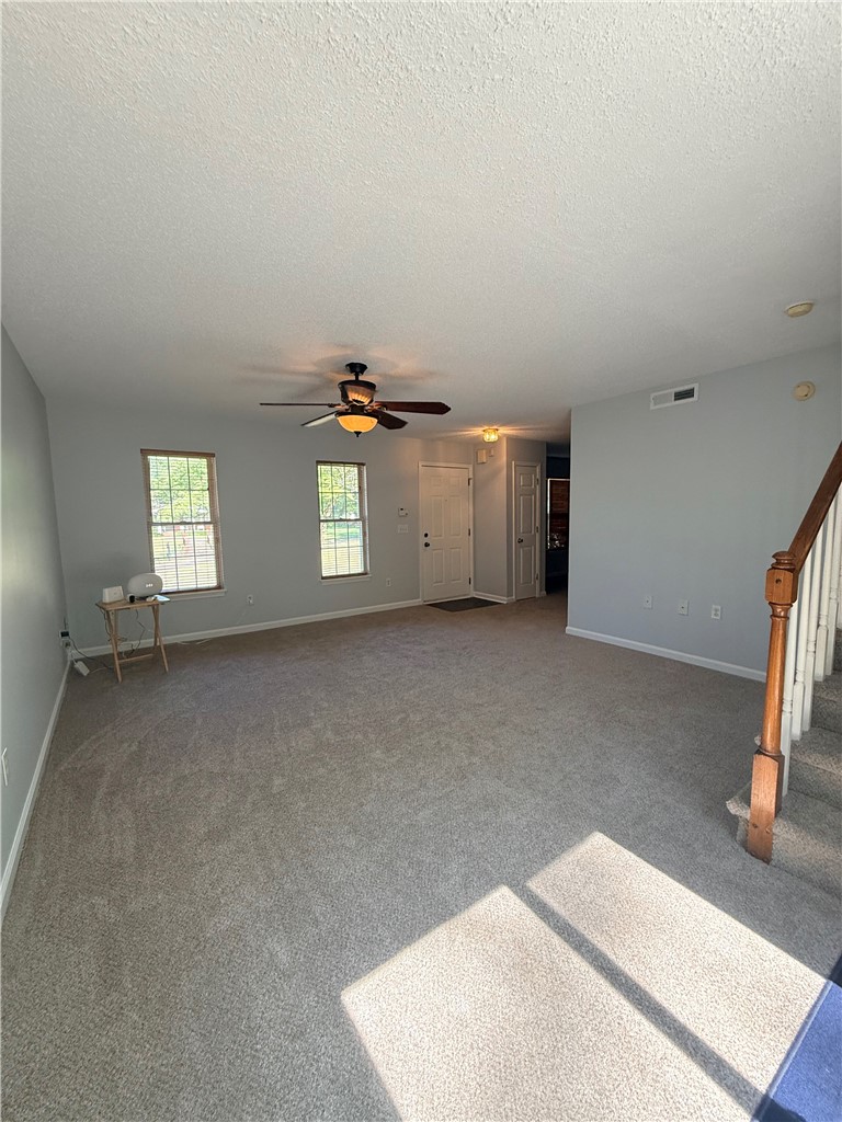 613 Brock Street Central, SC 29630 - Photo 4 of 28 This inviting space features natural light, comfortable flooring, and a classic ceiling fan.