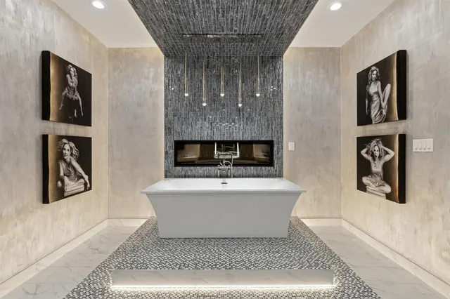 a living room with furniture pool table wooden floor and a rug