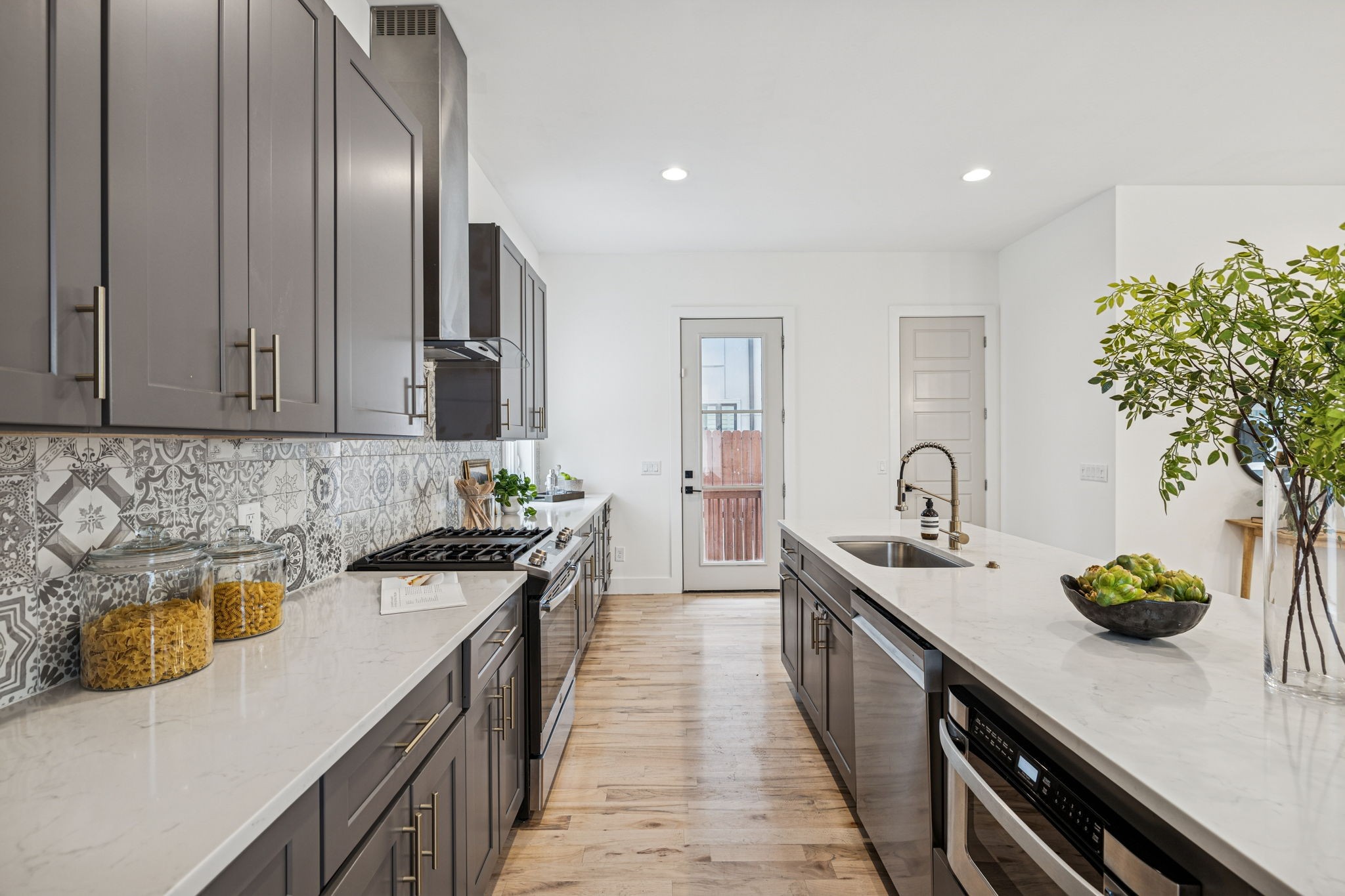 1403 10th Avenue North, Unit A Nashville, TN 37208 - Photo 14 of 53 a kitchen with stainless steel appliances a sink stove and cabinets