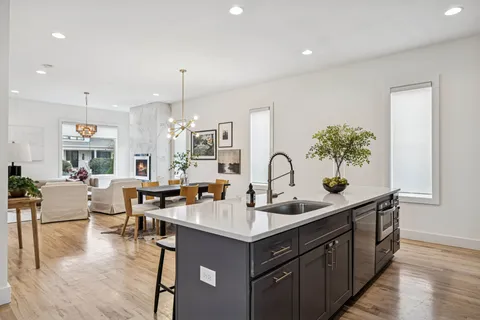 a bedroom with furniture and wooden floor
