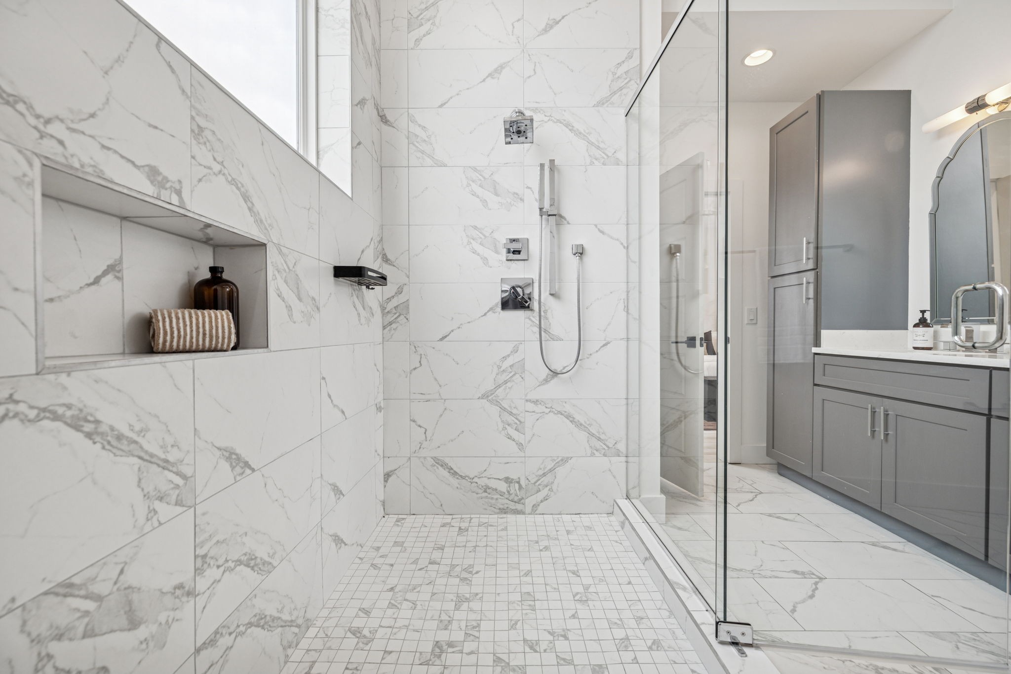 1403 10th Avenue North, Unit A Nashville, TN 37208 - Photo 20 of 53 a bathroom with a double vanity sink a mirror and shower