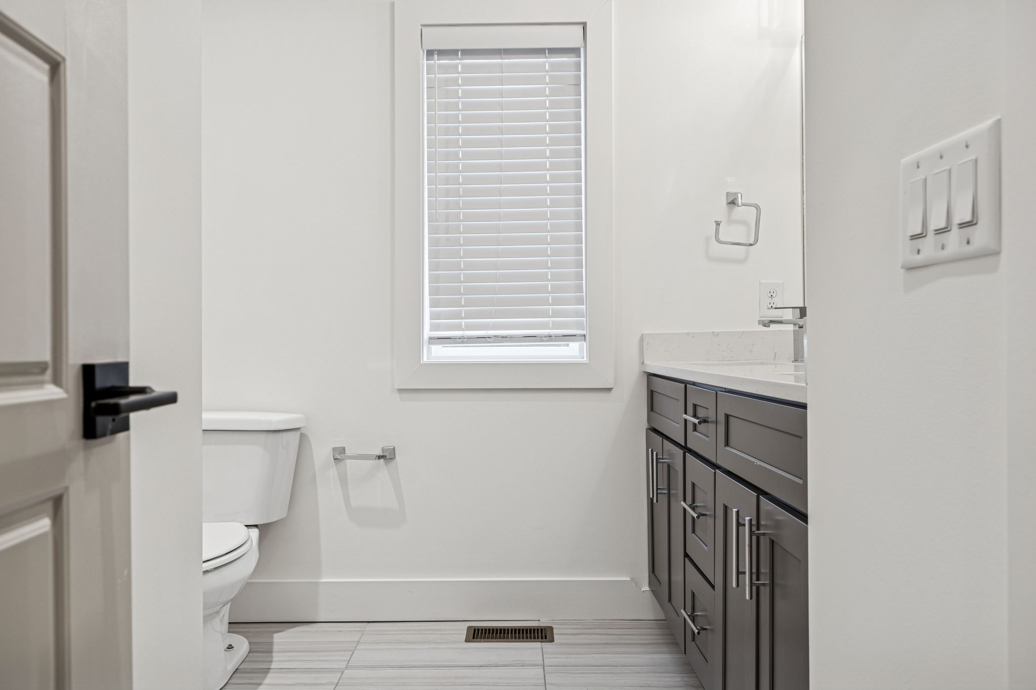 1403 10th Avenue North, Unit A Nashville, TN 37208 - Photo 25 of 53 a bathroom with a sink a toilet and a mirror