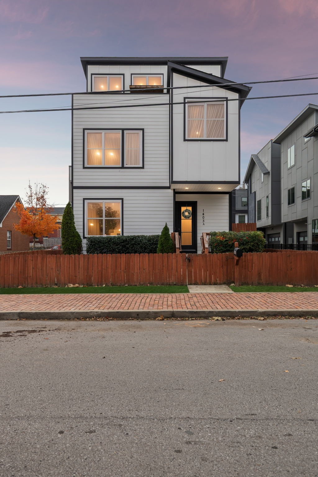 1403 10th Avenue North, Unit A Nashville, TN 37208 - Photo 40 of 53 a front view of a house with a yard
