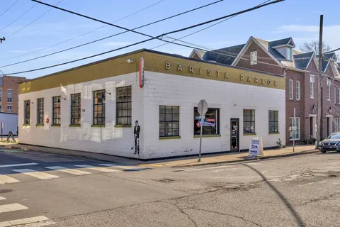 an aerial view of a house with a garden