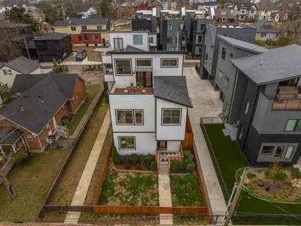 a table and chairs in front of a house