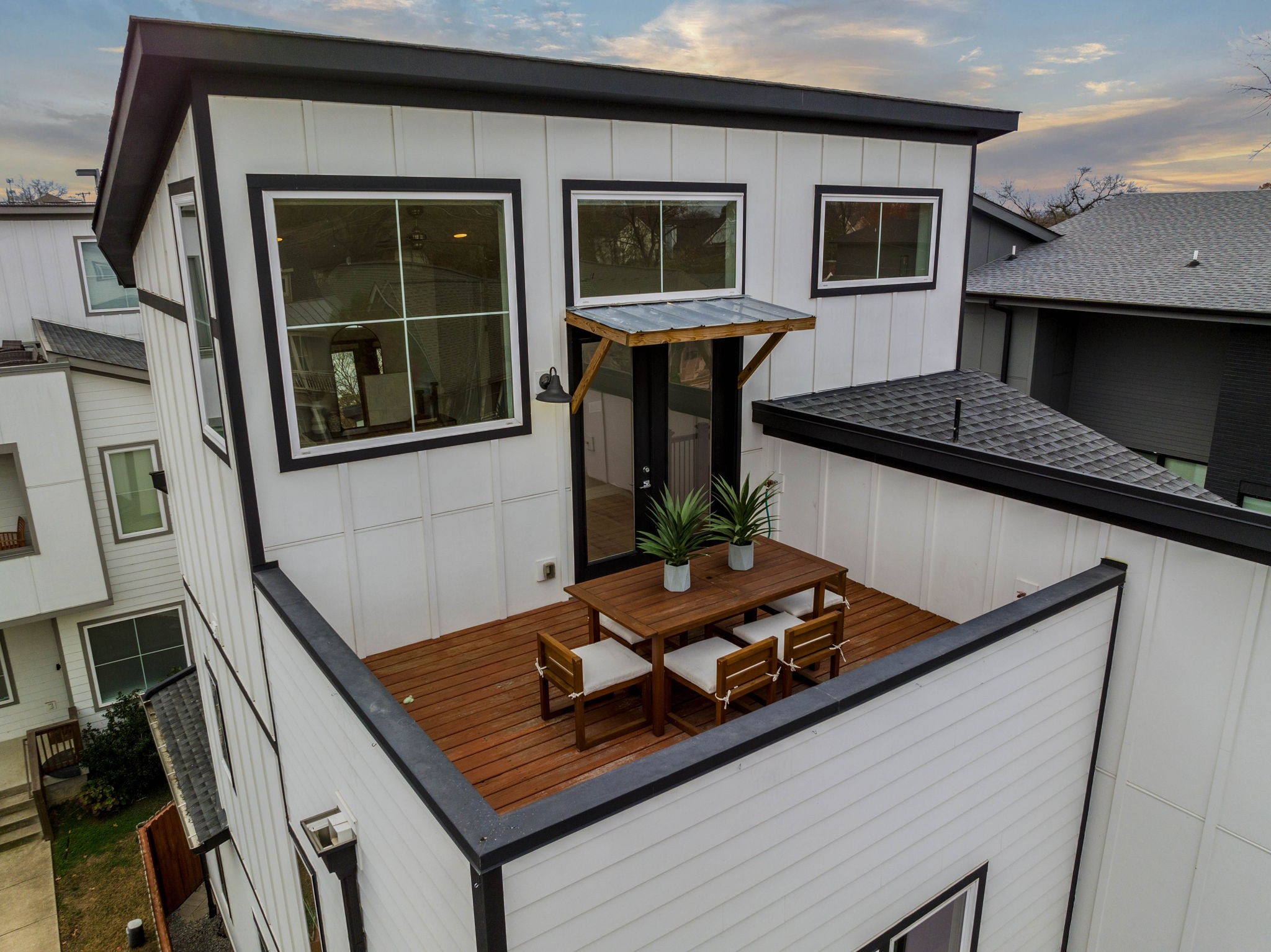 1403 10th Avenue North, Unit A Nashville, TN 37208 - Photo 49 of 53 a table and chairs in front of a house