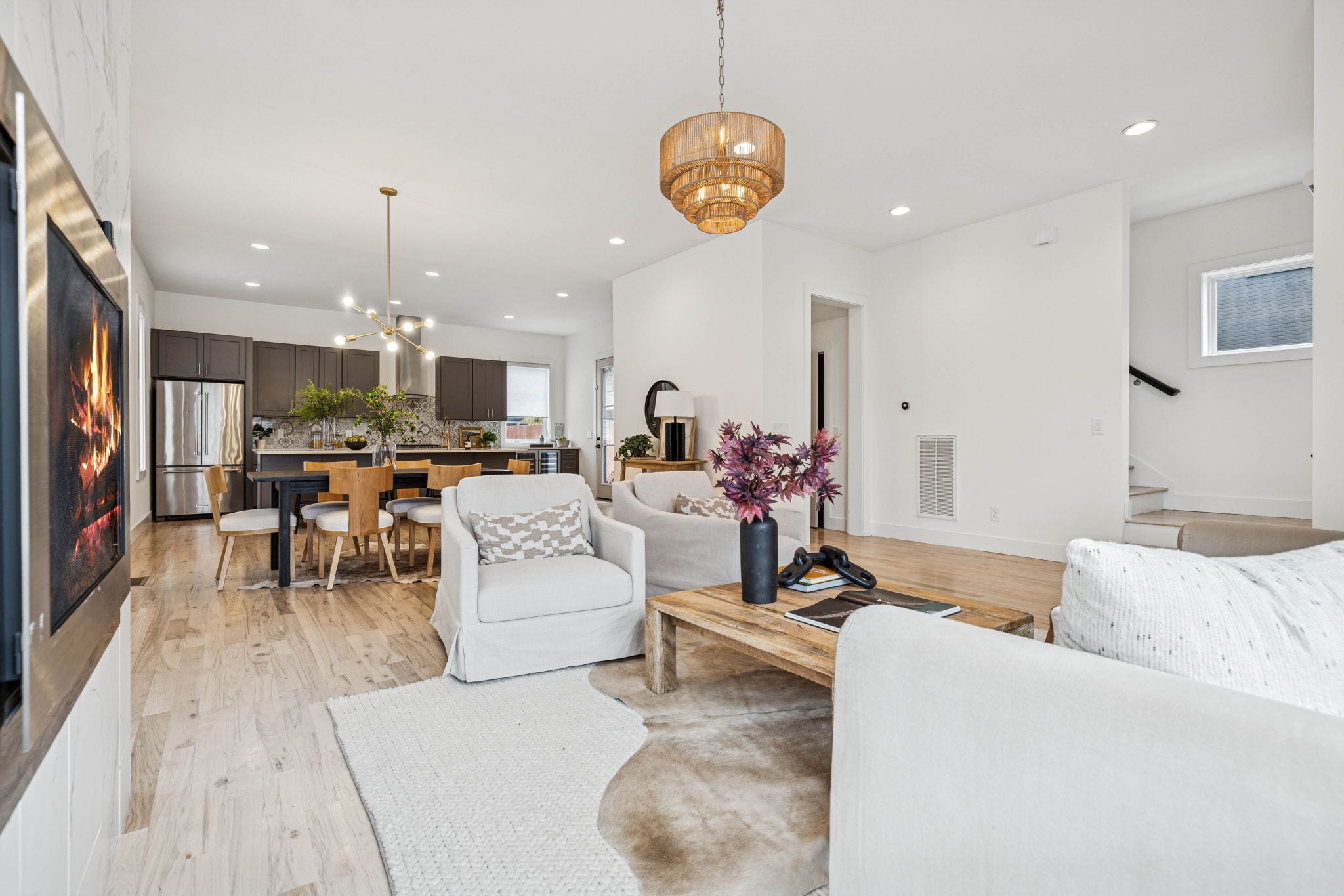 1403 10th Avenue North, Unit A Nashville, TN 37208 - Photo 5 of 53 a living room with furniture kitchen view and a chandelier