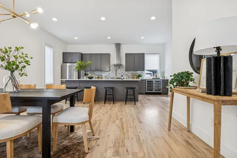 a view of a dining room with furniture window and wooden floor