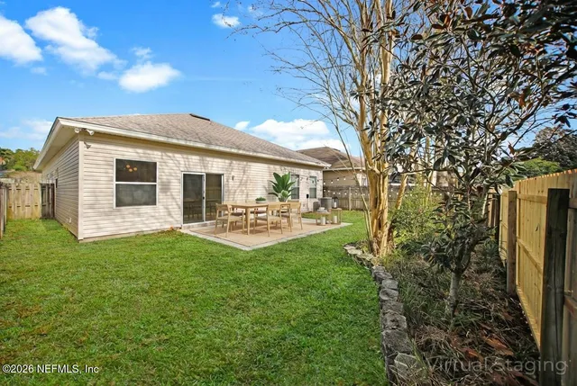 a front view of a house with yard porch and furniture