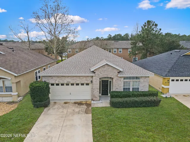 a view of a house with a garden