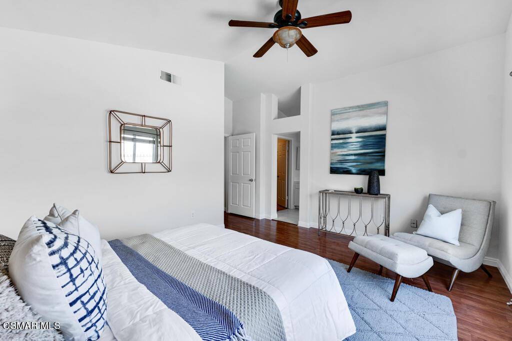 2676 Santa Ynez Avenue Simi Valley, CA 93063 - Photo 18 of 46 a bedroom with a bed and wooden floor