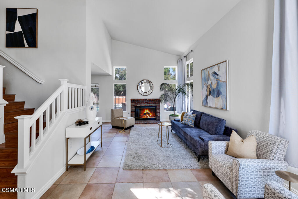 2676 Santa Ynez Avenue Simi Valley, CA 93063 - Photo 2 of 46 a living room with furniture and a fireplace