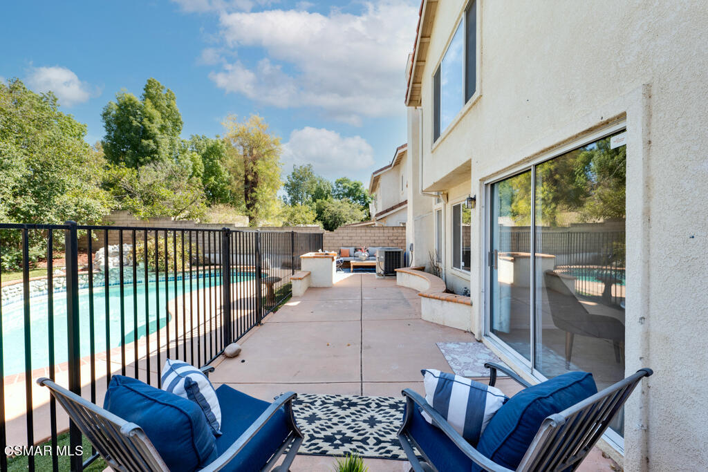 2676 Santa Ynez Avenue Simi Valley, CA 93063 - Photo 30 of 46 a view of a patio with couches chairs and wooden floor
