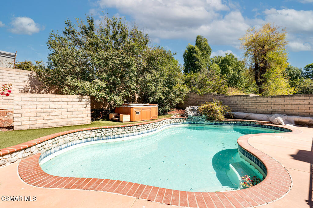 2676 Santa Ynez Avenue Simi Valley, CA 93063 - Photo 37 of 46 a view of a swimming pool with a yard