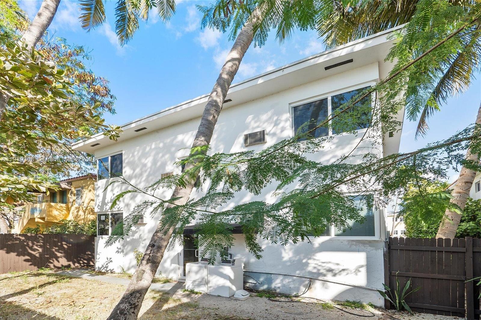 7510 Byron Avenue, Unit 8 Miami Beach, FL 33141 - Photo 13 of 15 a house that has a tree in front of it