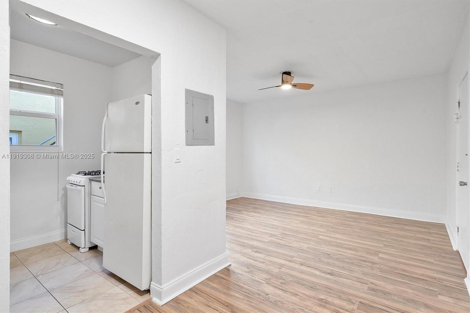 7510 Byron Avenue, Unit 8 Miami Beach, FL 33141 - Photo 2 of 15 wooden floor in an empty room
