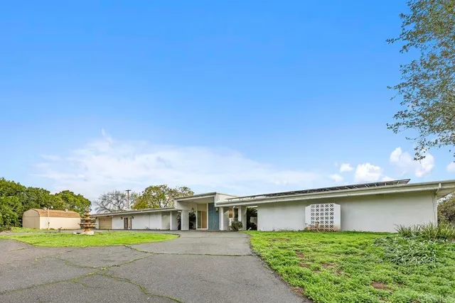 a house view with a garden space
