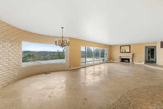 a view of empty room with floor to ceiling window