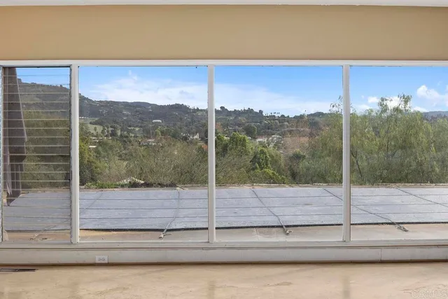 a view of a glass door and a window