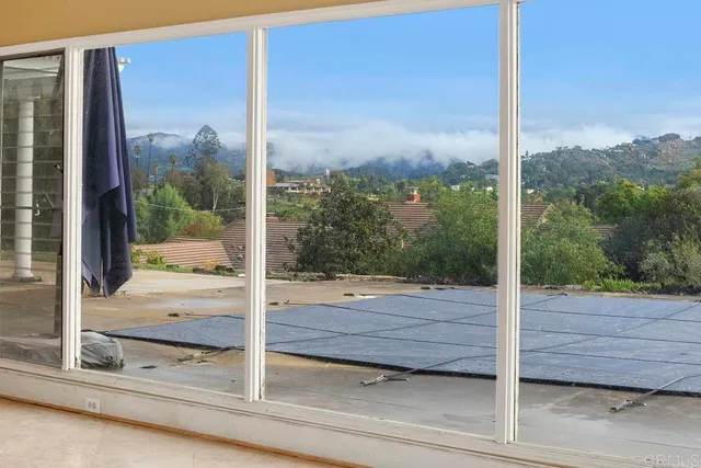 a view of a door and a window