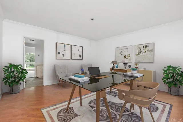 a workspace with furniture and a potted plant