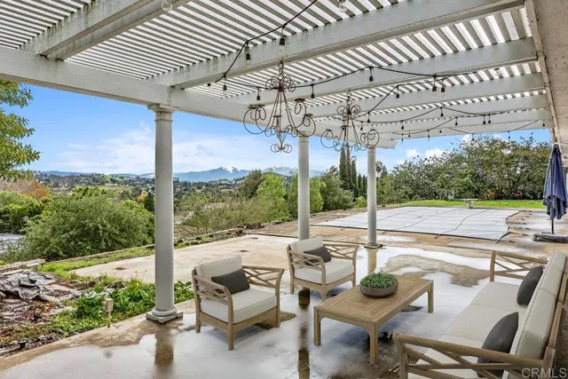a view of a patio with a table chairs and a patio