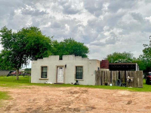 5910 Alpine Avenue Mission, TX 78574 - Photo 2 of 15 a front view of a house with a yard and garage