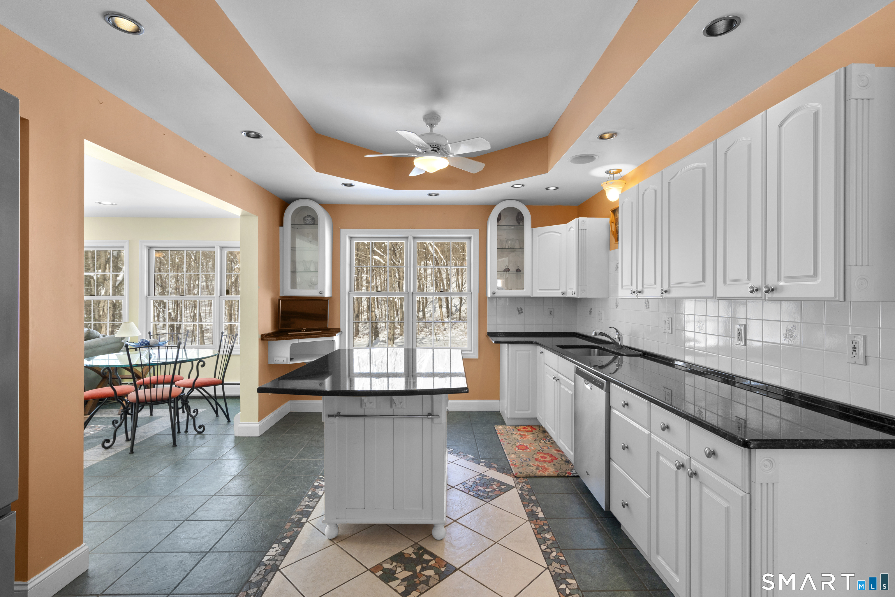 1729 Litchfield Road Watertown, CT 06795 - Photo 14 of 39 a kitchen with stainless steel appliances granite countertop a stove a sink dishwasher and white cabinets with wooden floor