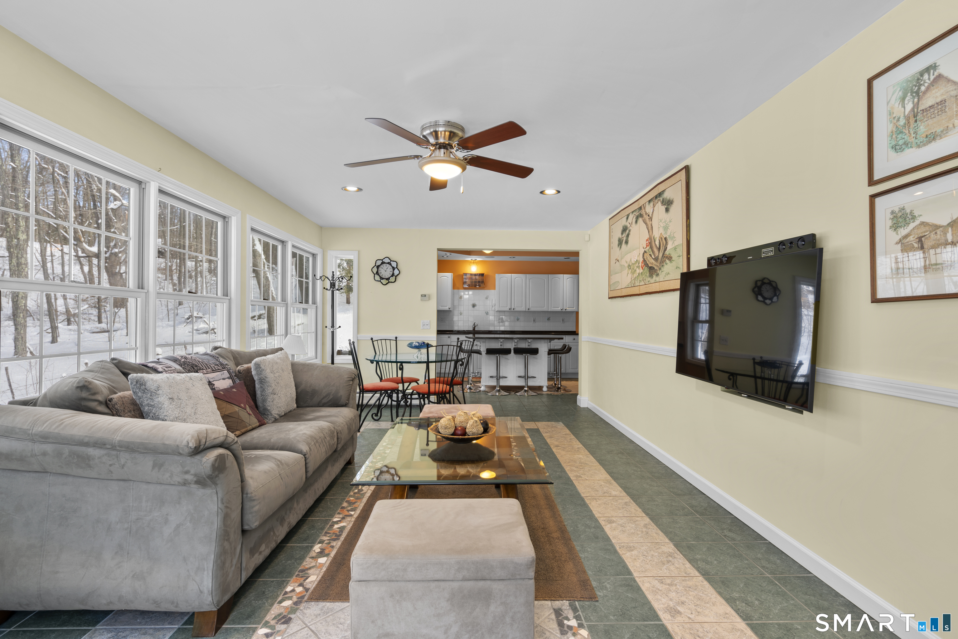 1729 Litchfield Road Watertown, CT 06795 - Photo 16 of 39 a living room with furniture ceiling fan and a rug