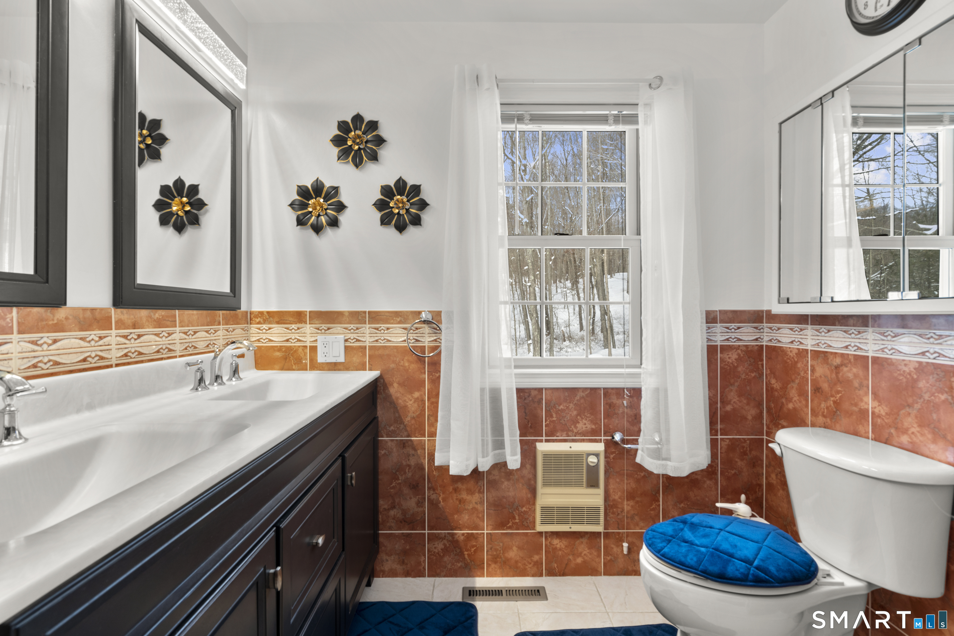 1729 Litchfield Road Watertown, CT 06795 - Photo 20 of 39 a bathroom with a sink a toilet and a window