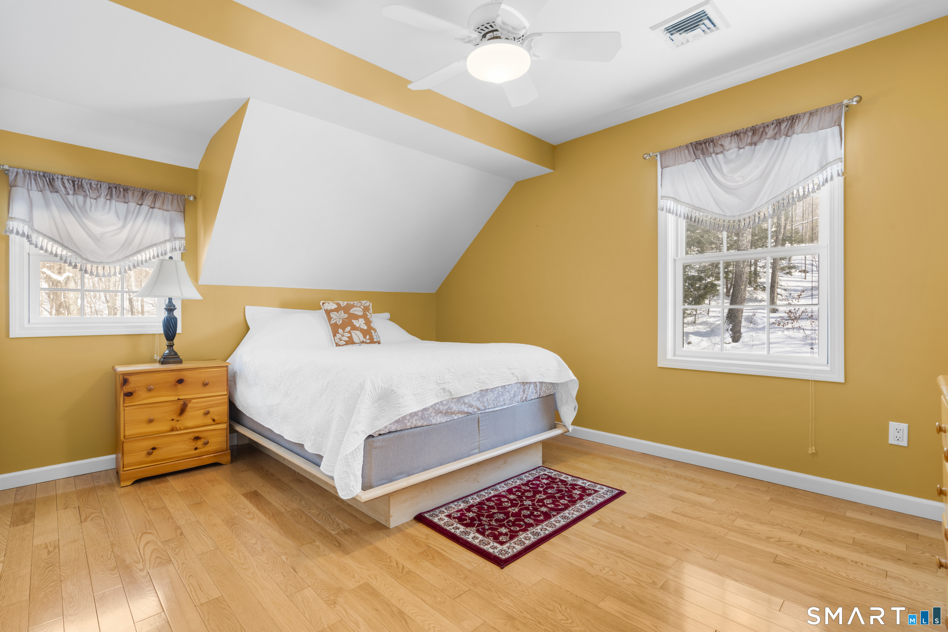 1729 Litchfield Road Watertown, CT 06795 - Photo 24 of 39 a bedroom with a bed and a painting on the wall