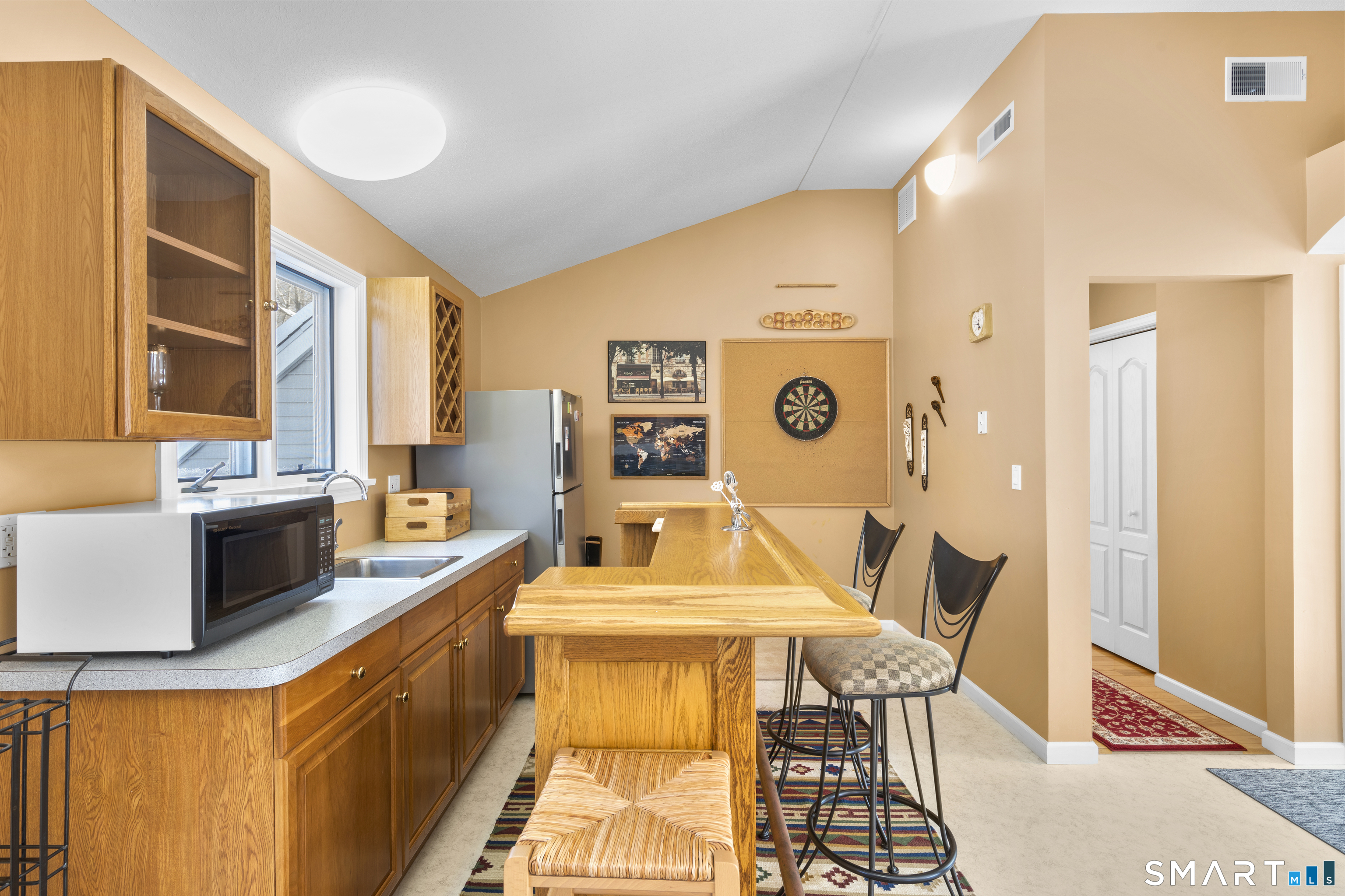 1729 Litchfield Road Watertown, CT 06795 - Photo 26 of 39 a living room with stainless steel appliances kitchen island granite countertop furniture and a kitchen view