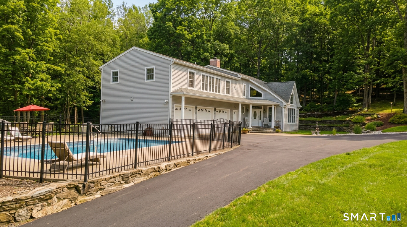 1729 Litchfield Road Watertown, CT 06795 - Photo 4 of 39 a front view of a house with a garden and yard