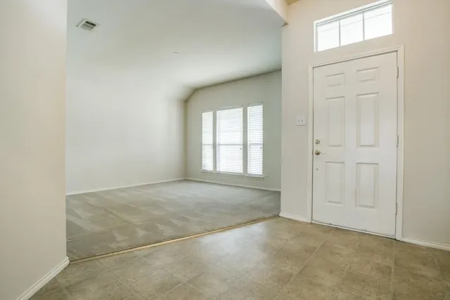 an empty room with windows