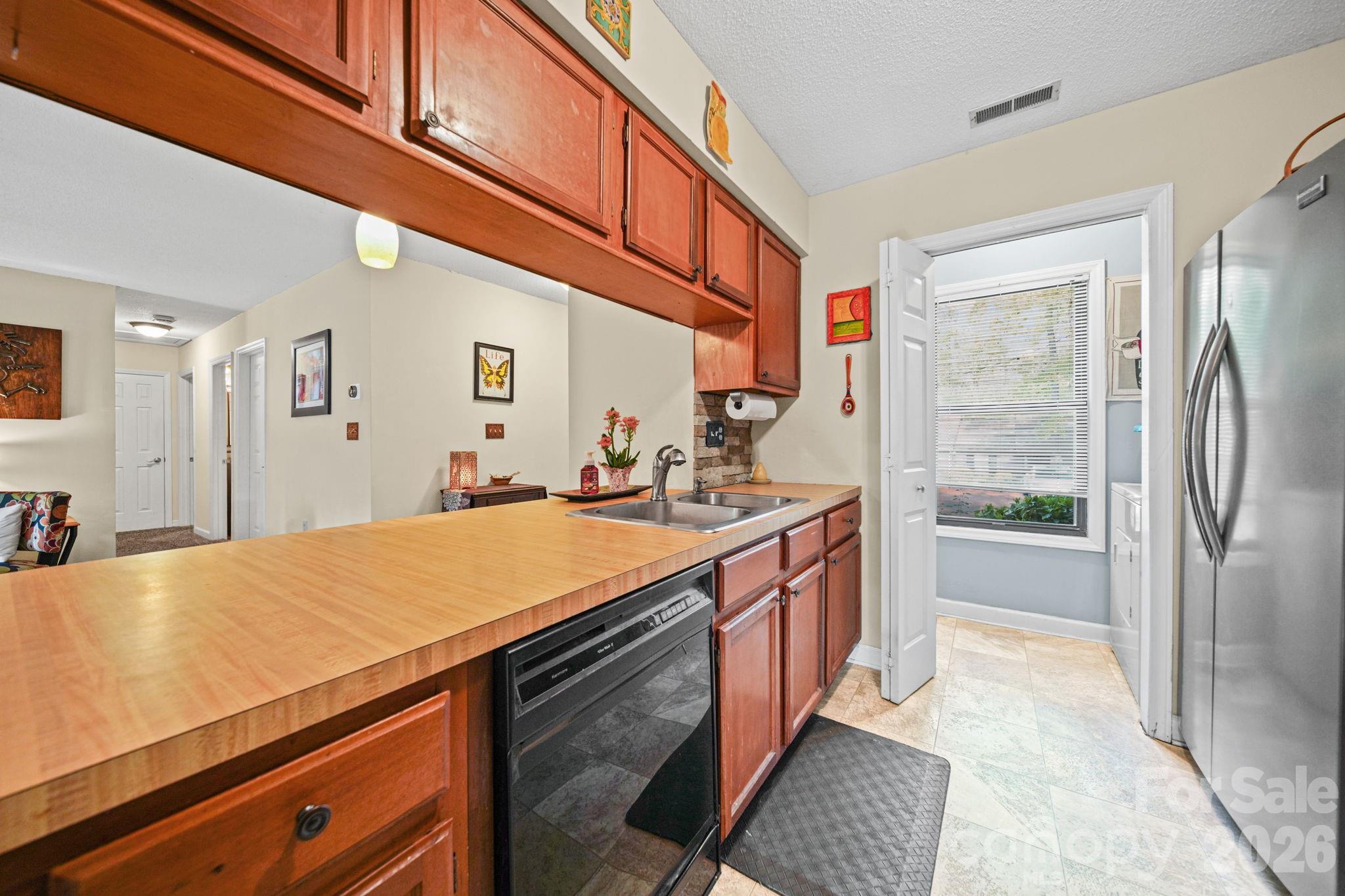 2788 Red Bud Lane Fort Mill, SC 29715 - Photo 12 of 35 a spacious bathroom with a granite countertop sink and a mirror