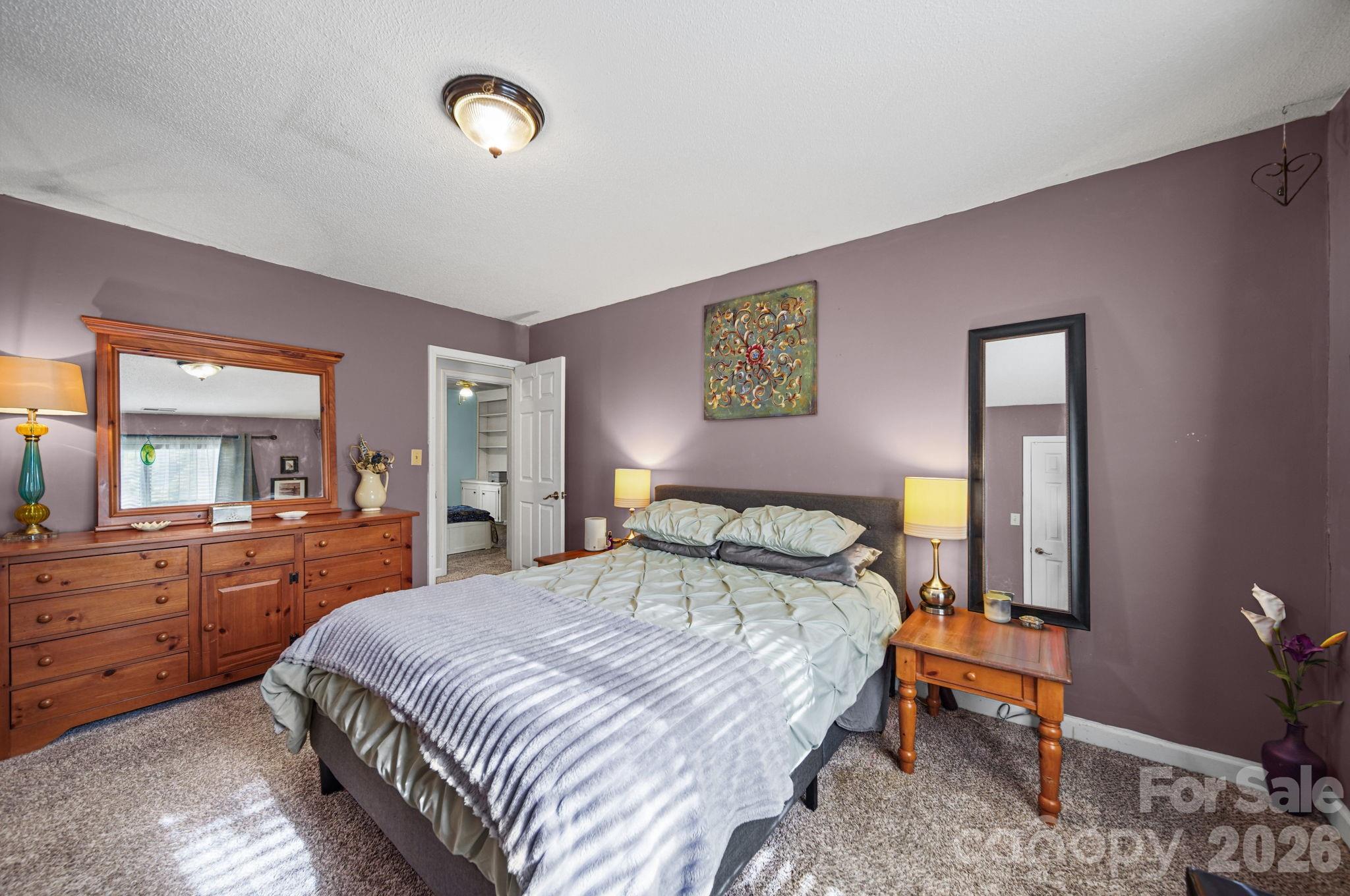 2788 Red Bud Lane Fort Mill, SC 29715 - Photo 17 of 35 a bedroom with a bed and wooden floor