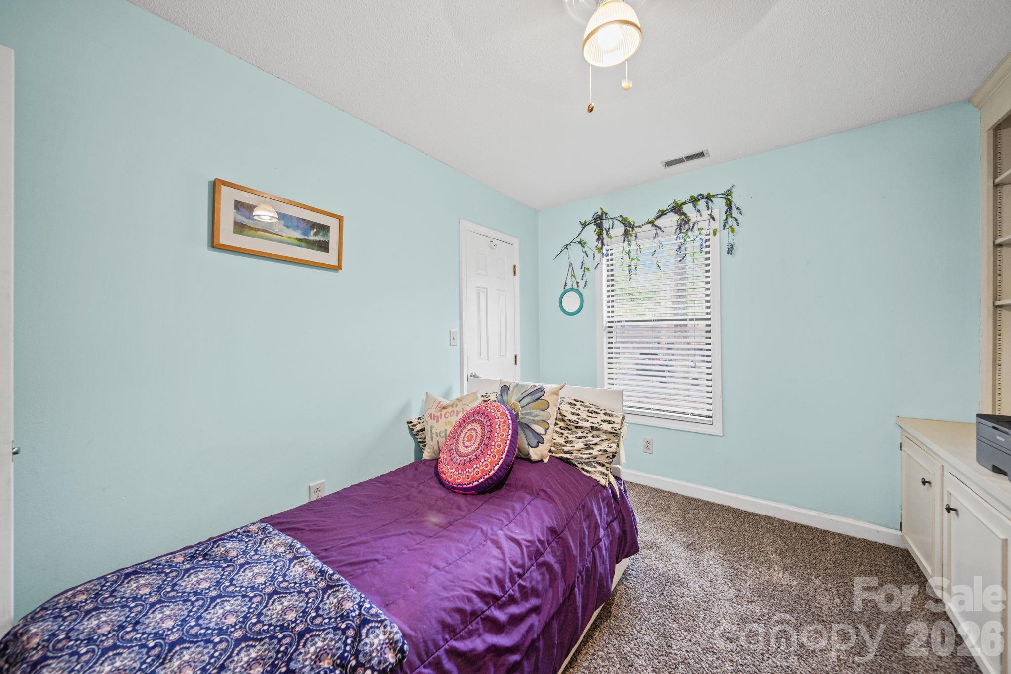 2788 Red Bud Lane Fort Mill, SC 29715 - Photo 25 of 35 a bedroom with a bed and a window