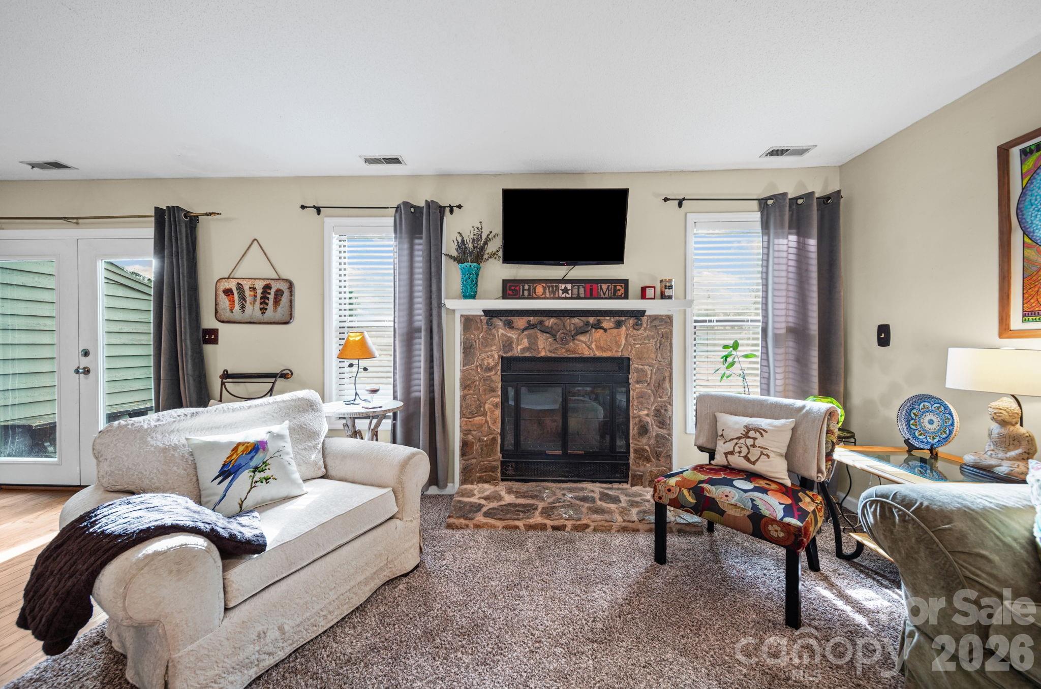 2788 Red Bud Lane Fort Mill, SC 29715 - Photo 5 of 35 a living room with furniture fireplace and flat screen tv