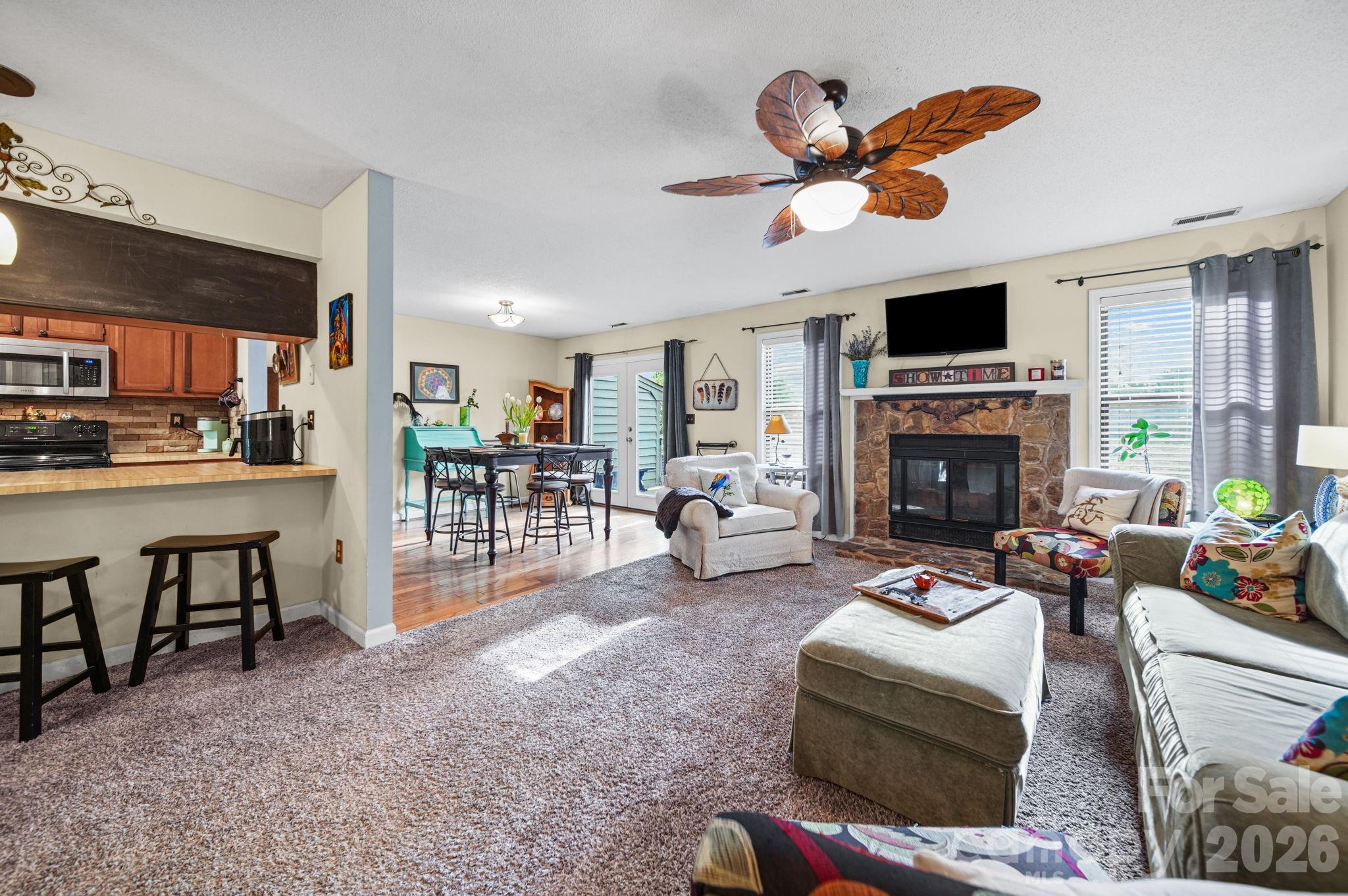 2788 Red Bud Lane Fort Mill, SC 29715 - Photo 6 of 35 a living room with furniture a fireplace and a flat screen tv