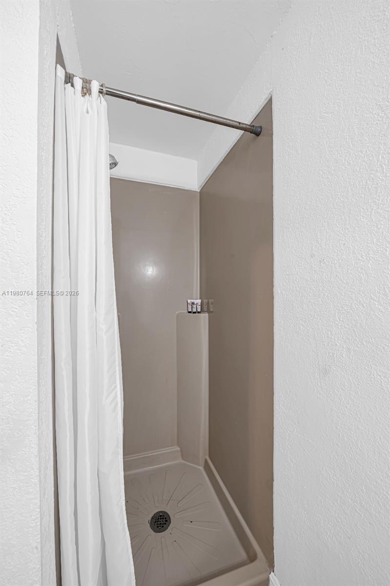 1044 Southwest 13th Court, Unit 2 Miami, FL 33135 - Photo 12 of 17 a bathroom with a shower