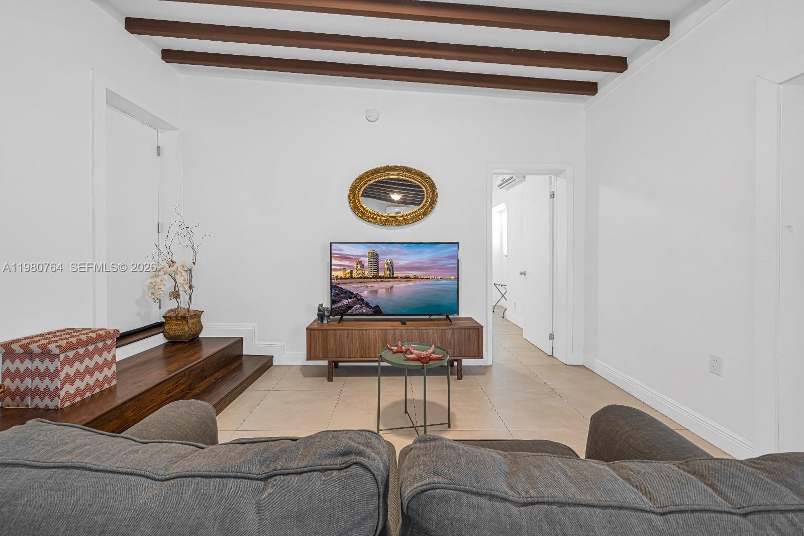 1044 Southwest 13th Court, Unit 2 Miami, FL 33135 - Photo 17 of 17 a living room with furniture and a rug