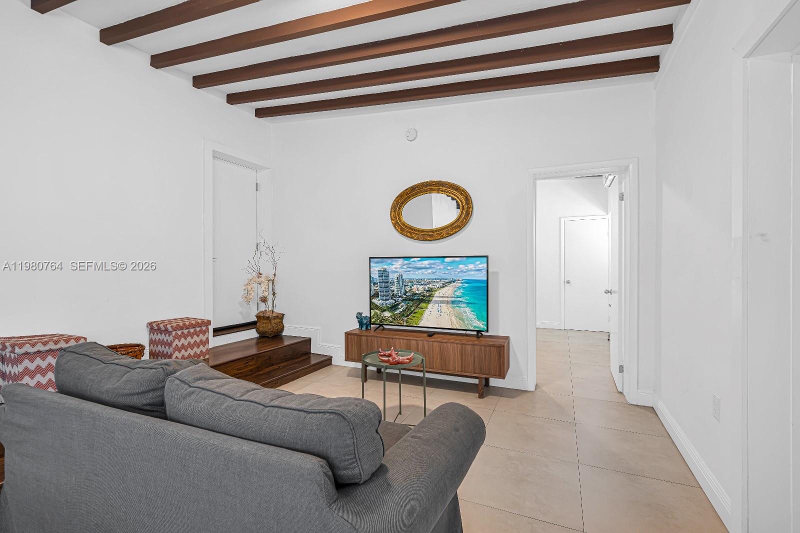 1044 Southwest 13th Court, Unit 2 Miami, FL 33135 - Photo 5 of 17 a living room with furniture and a window