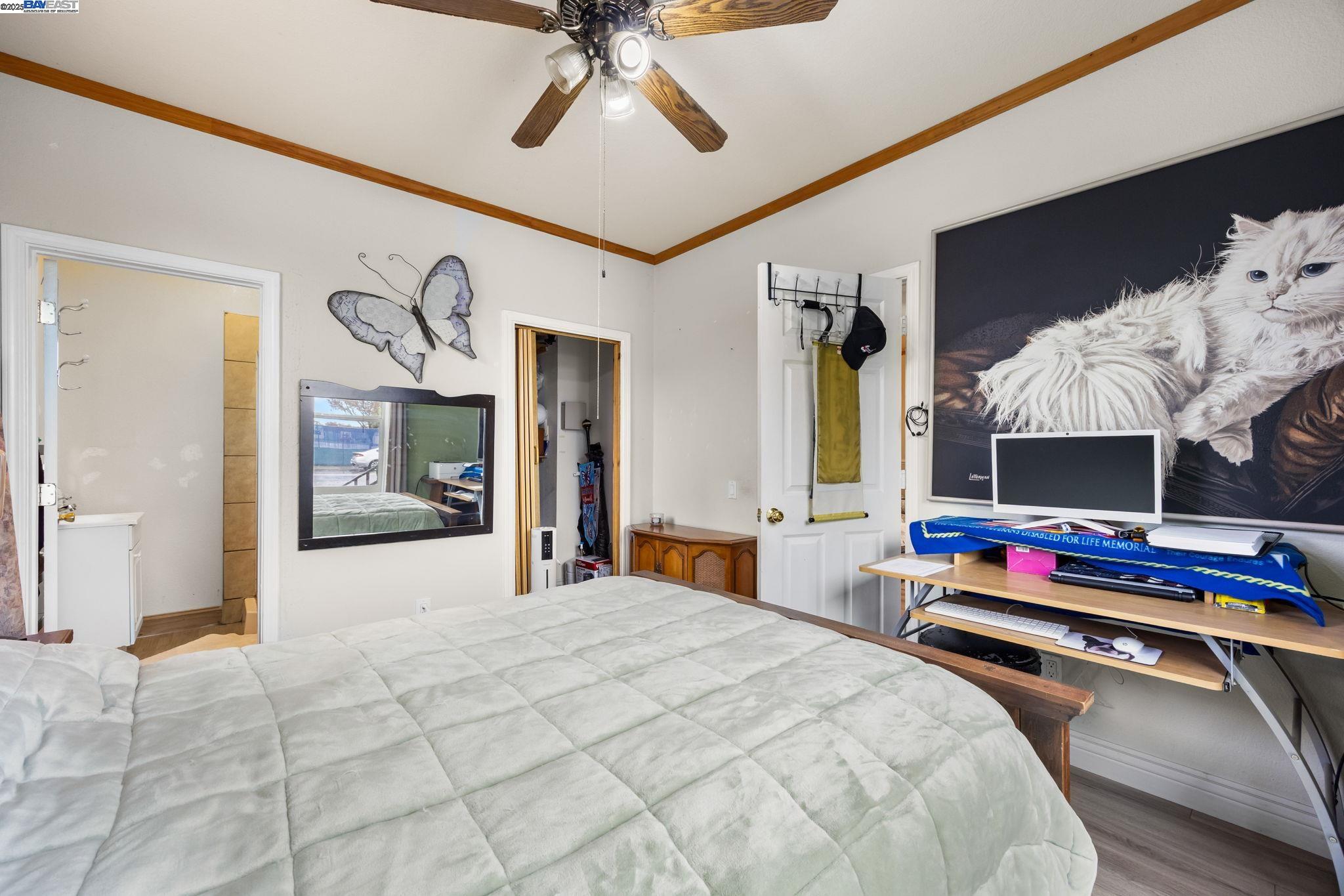 2421 West Rumble Road Modesto, CA 95350 - Photo 12 of 25 a bedroom with bed and a chandelier