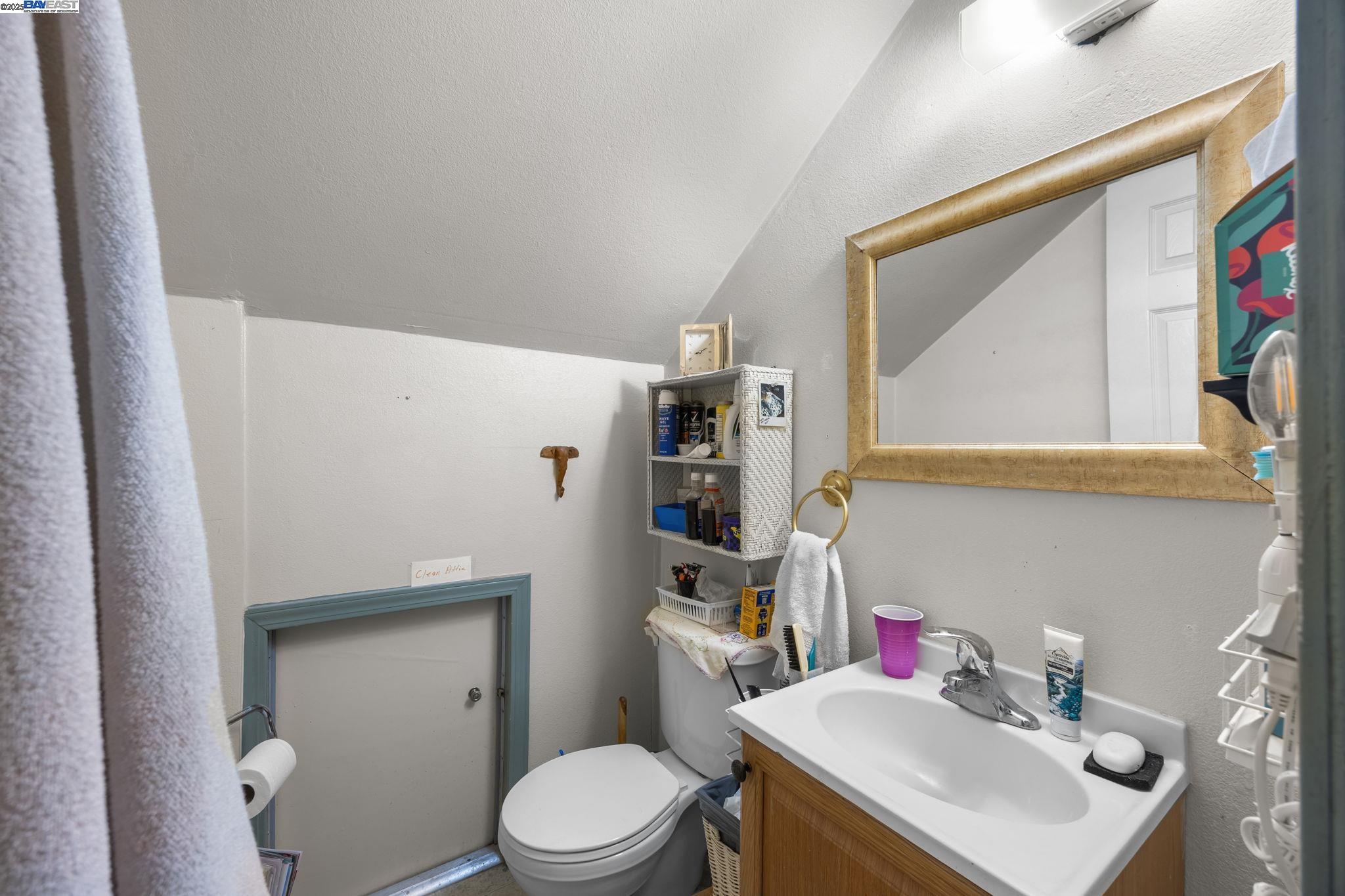 2421 West Rumble Road Modesto, CA 95350 - Photo 17 of 25 a bathroom with a sink a toilet and a mirror